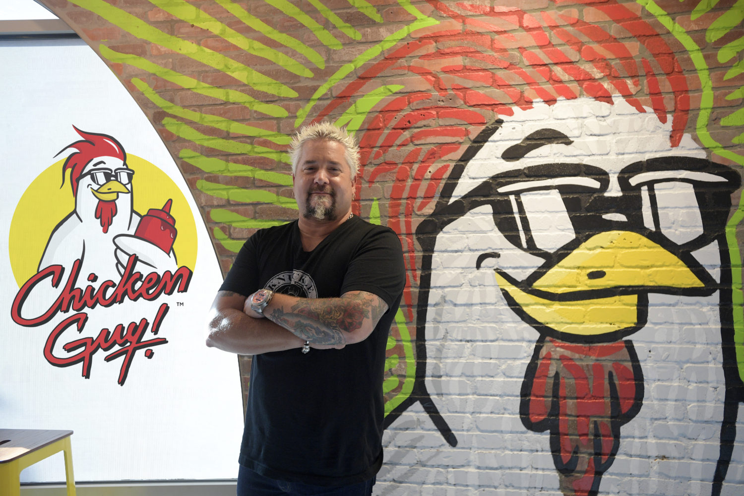Lake Buena Vista, Fla. (August 30, 2018) - Chef Guy Fieri was at Chicken Guy! at Disney Springs today for a special ribbon-cutting ceremony. Hundreds of guests were lined up in anticipation of the ceremony and were rewarded for their enthusiasm with a tasty treat, as Fieri handed out samples of his chicken tenders and many of his 22 signature sauces to the hungry crowd. Thursday, Aug. 30, 2018, in Lake Buena Vista, Fla. (Phelan M. Ebenhack)